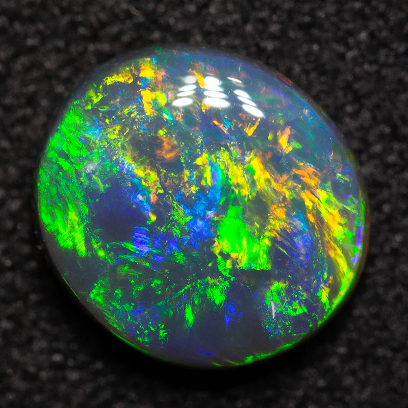 1.03 ct black opal 7.6x6.9x2.9mm