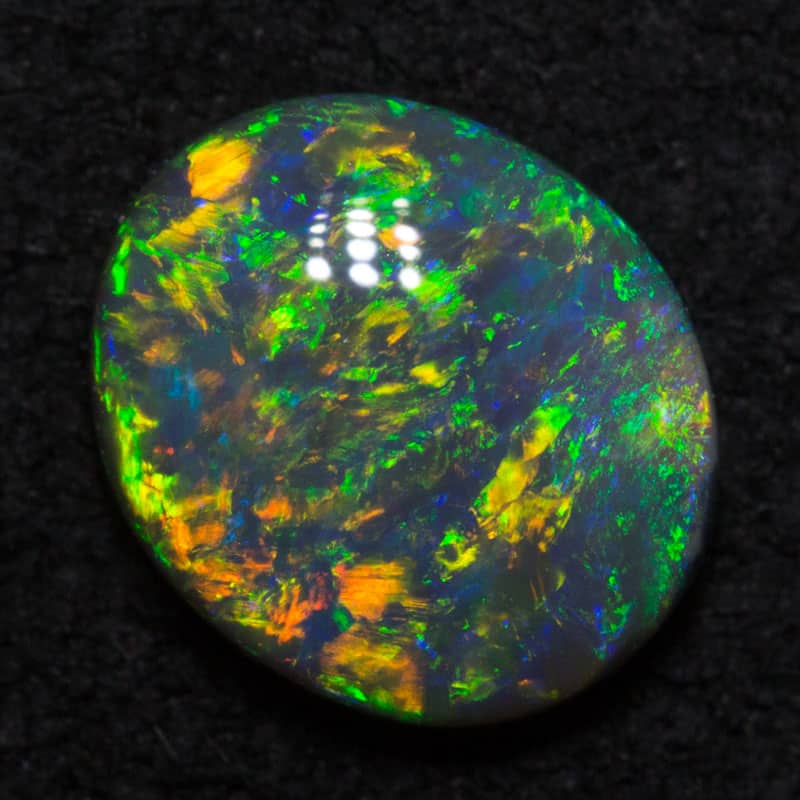 1.03 ct black opal 8x6.9x2.9mm