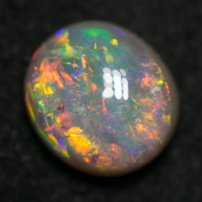 1.03 ct dark opal 7x6x3.5mm