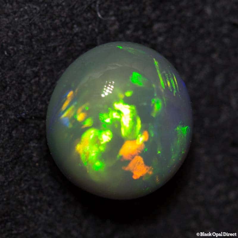1.06 ct black opal 6mm round x4mm