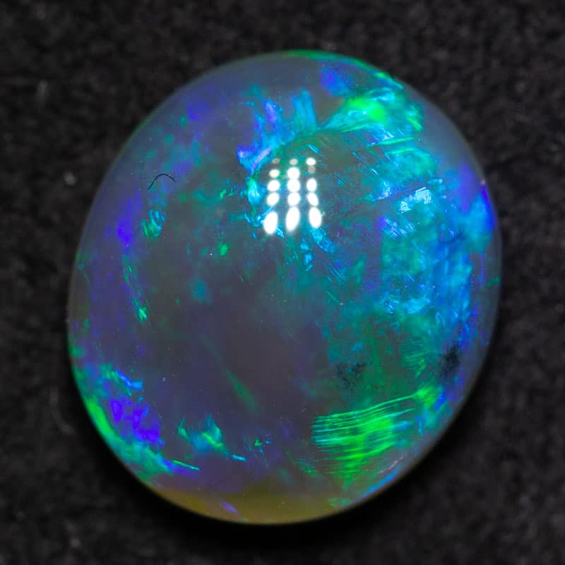 1.07 dark crystal opal 7.7x6.8x3.5mm