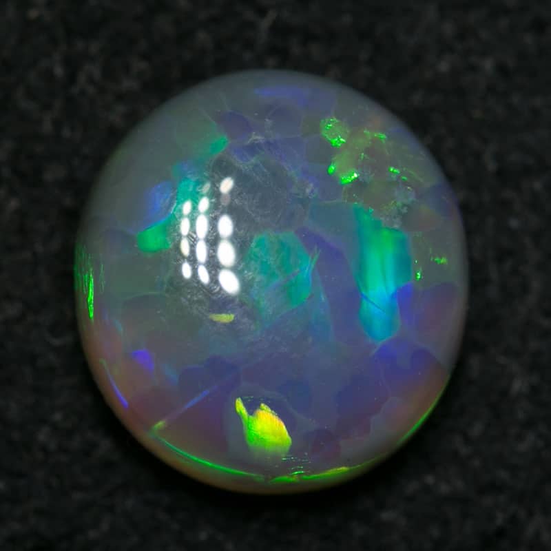 1.08 ct dark opal 7x6.5x3mm