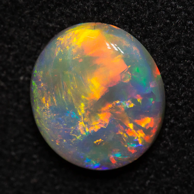 1.09 ct dark opal 8x7.3x2.7mm