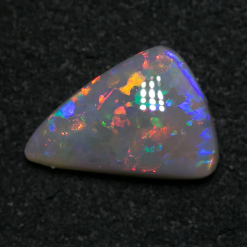 1.13 ct dark opal baroque shape 10x7x3mm