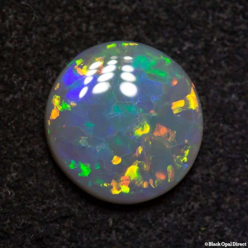 1.22 ct dark opal 8.5mm round x 2.5 thick