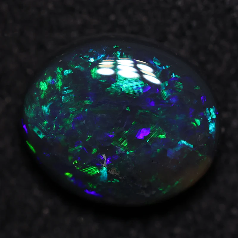 1.24 ct black opal 8.1x6.8x3.4mm