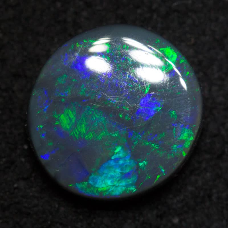 1.24 ct black opal 8x7.6x2.9mm
