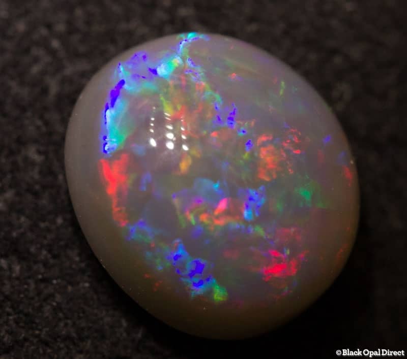 1.24 ct semi black opal 7.5x7x4mm