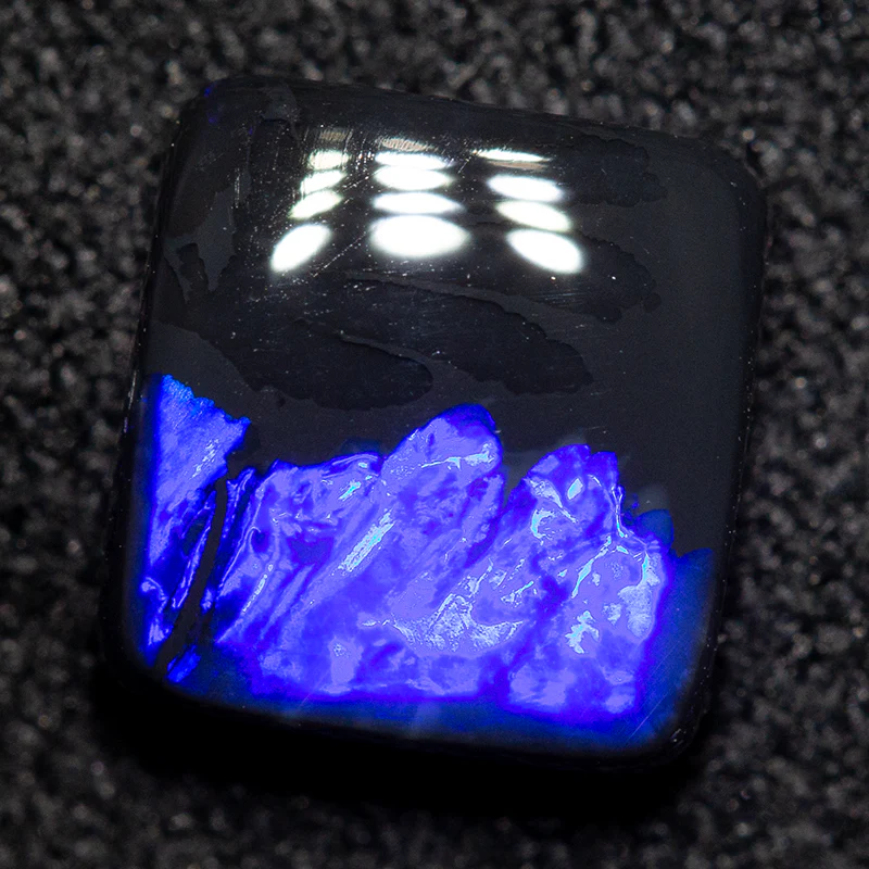 1.25 ct black opal 7.2x6.8x2.7mm