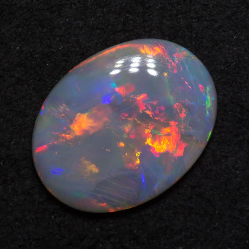 1.25 ct dark opal 10.8x8.3x2.2mm