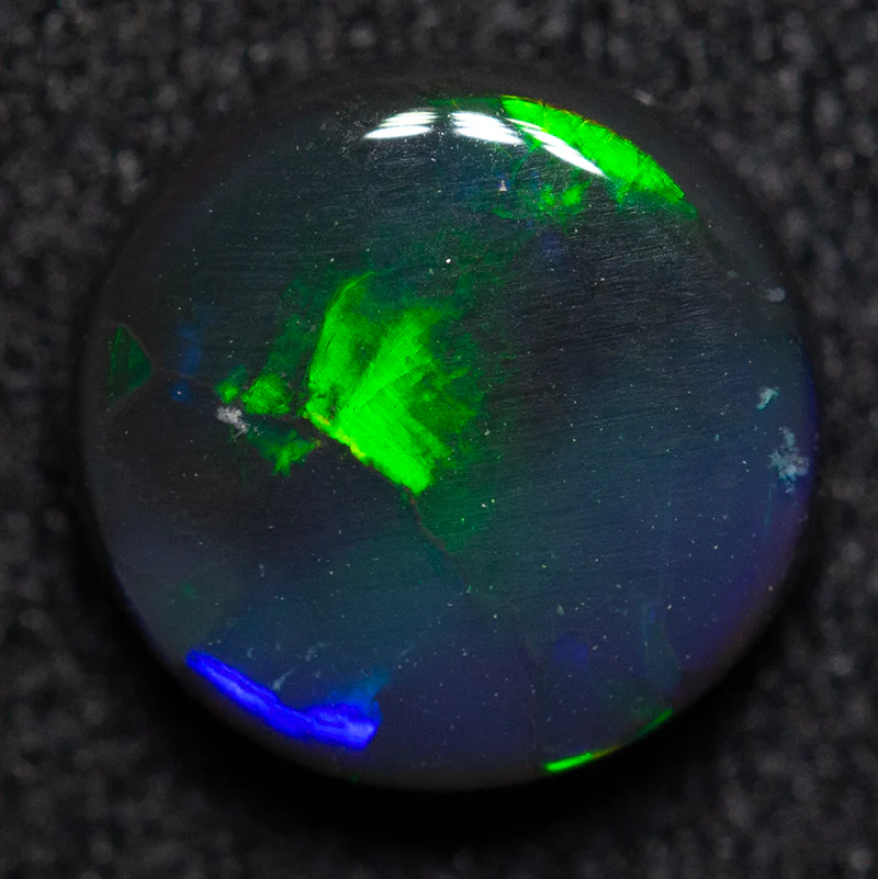 1.27 ct black opal 7.7x7.5x2.8mm