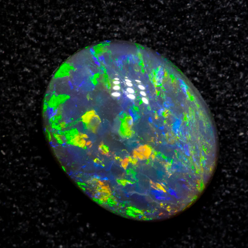 1.28 ct black opal 8.1x6.6x3.4mm
