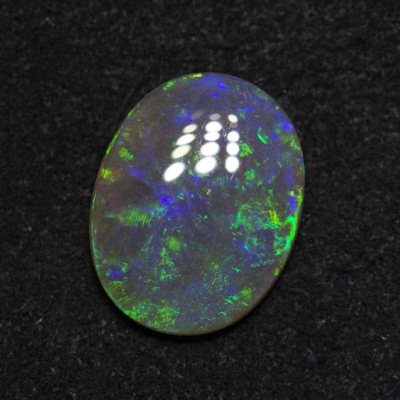 1.30 ct dark crystal opal 9.9x7.7x2.6mm
