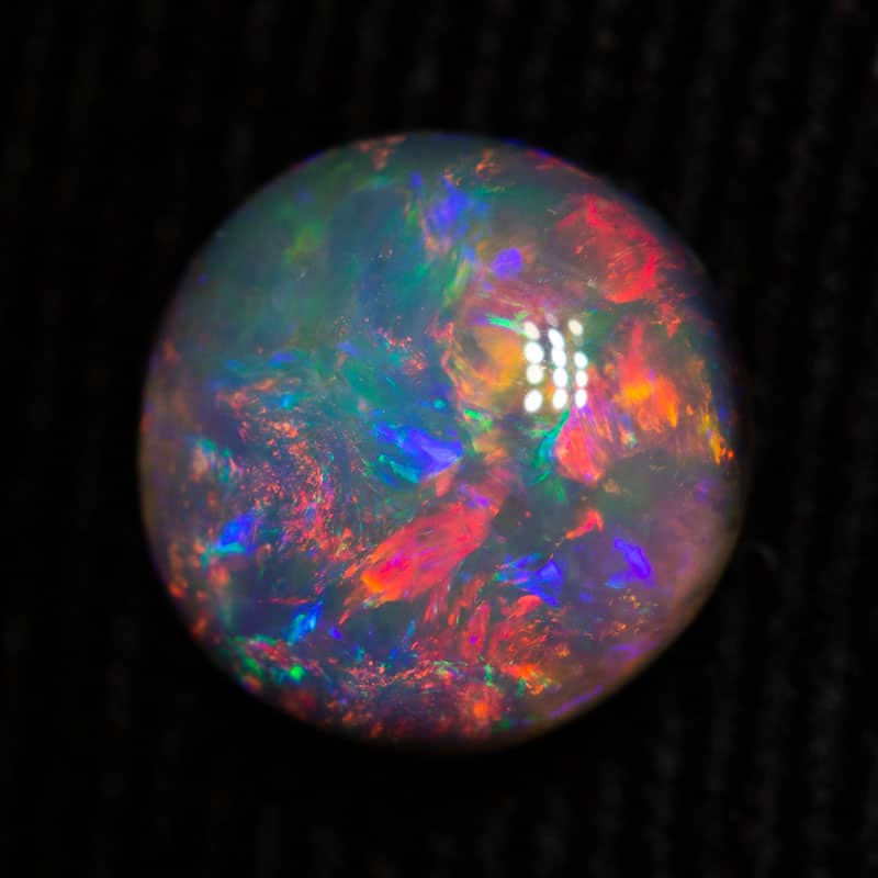 1.42 ct black opal gem 8mm round x 2.3mm