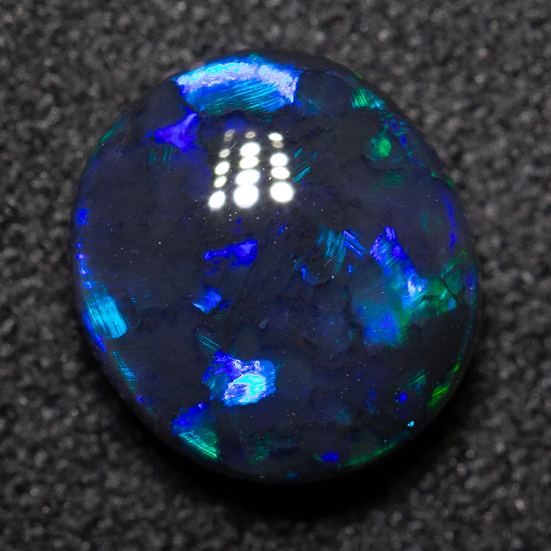 1.46 ct double-sided black opal 8.1x7.3x3.7mm
