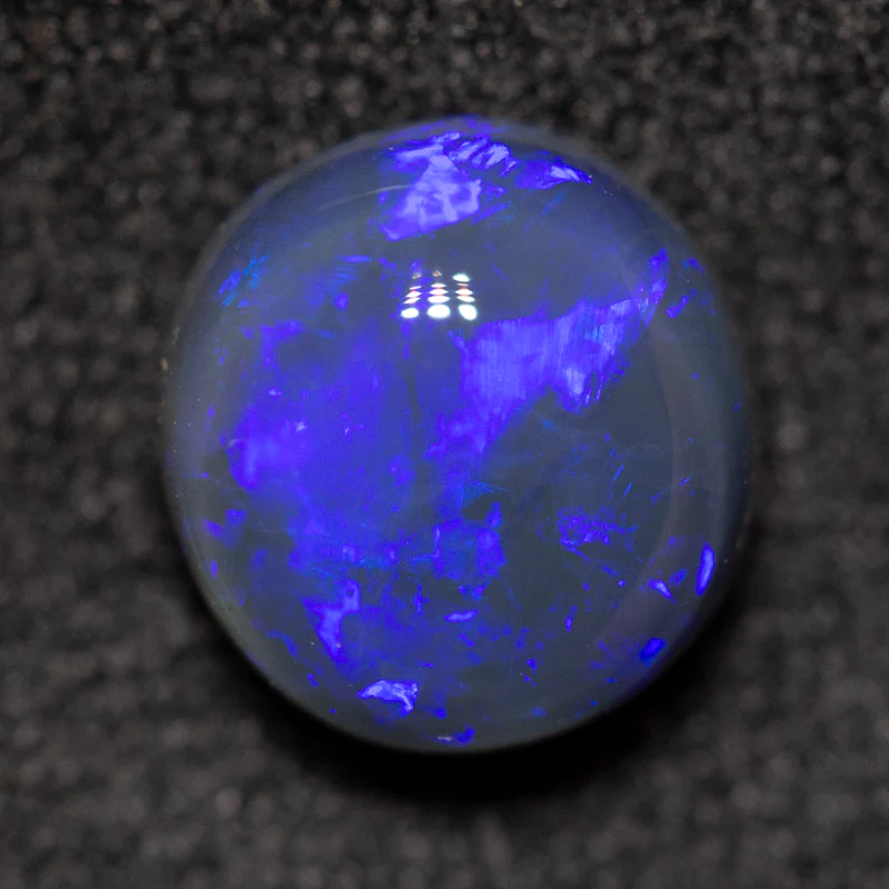 1.53 ct black opal 7.7x7.3x4.4mm