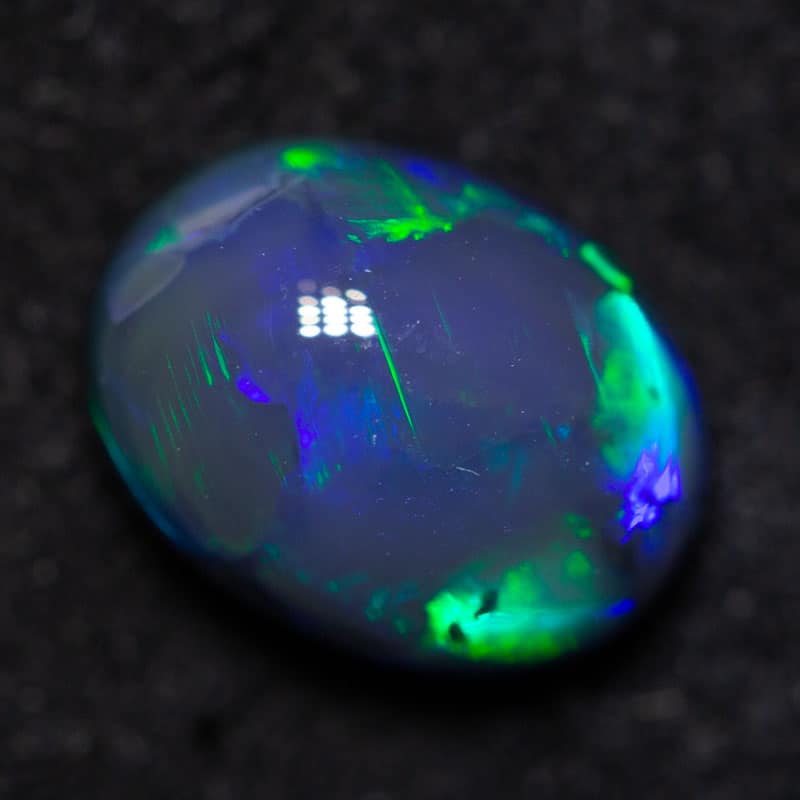 1.55 ct black opal 8.5x6.5x4.5mm