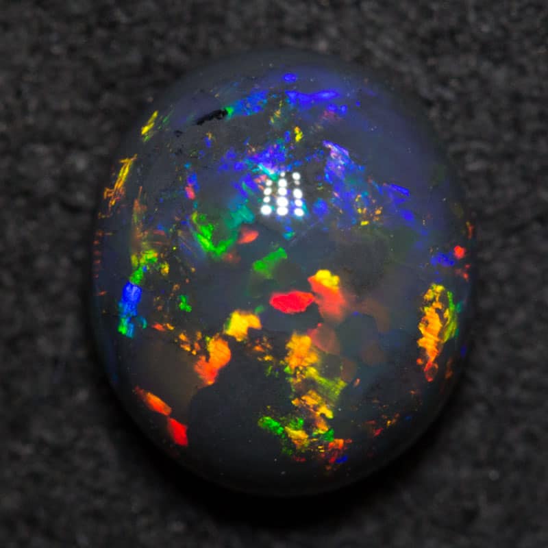 1.57 ct black opal 8x7.1x4.3mm