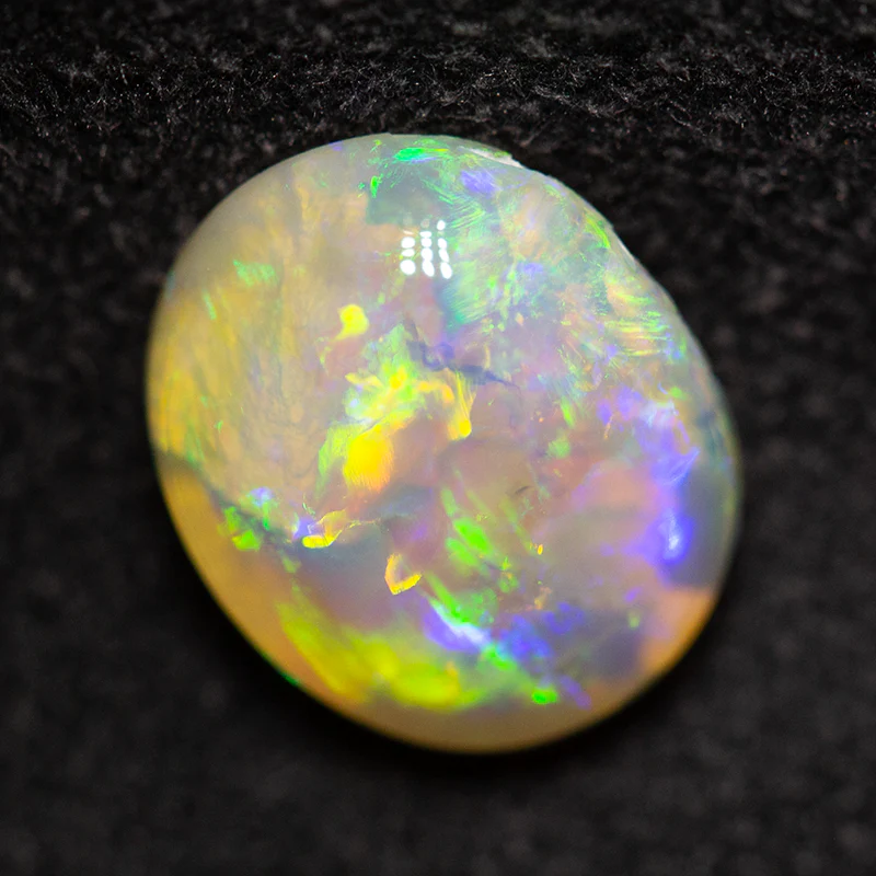 1.58 ct crystal opal 9.5x7.9x3.6mm