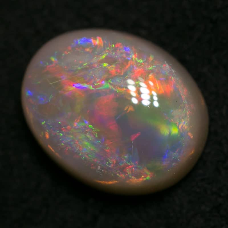 1.60 ct dark opal 8.5x7x4mm