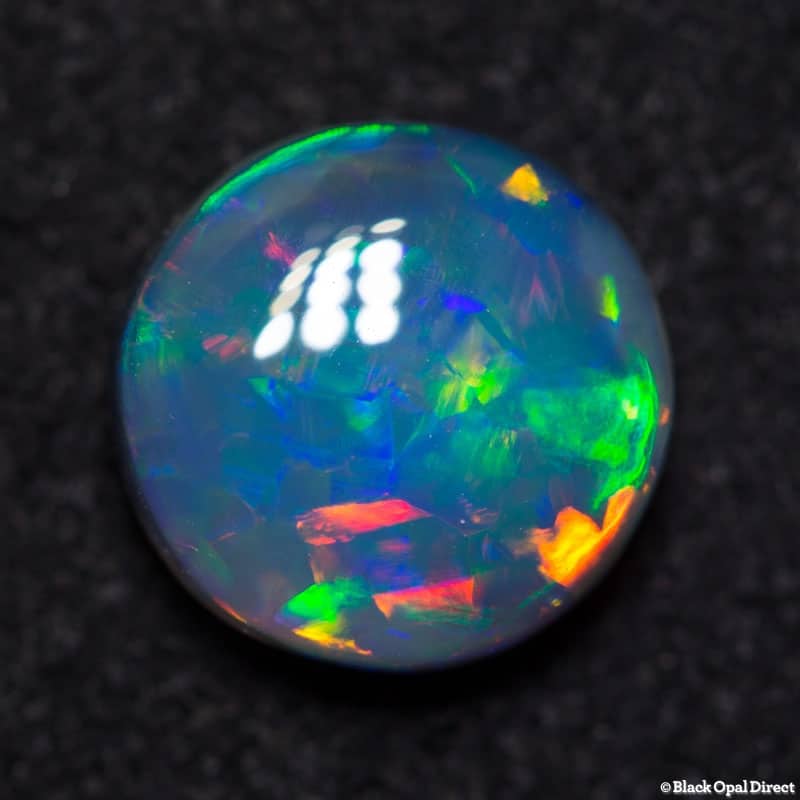 1.84 ct green red dark opal