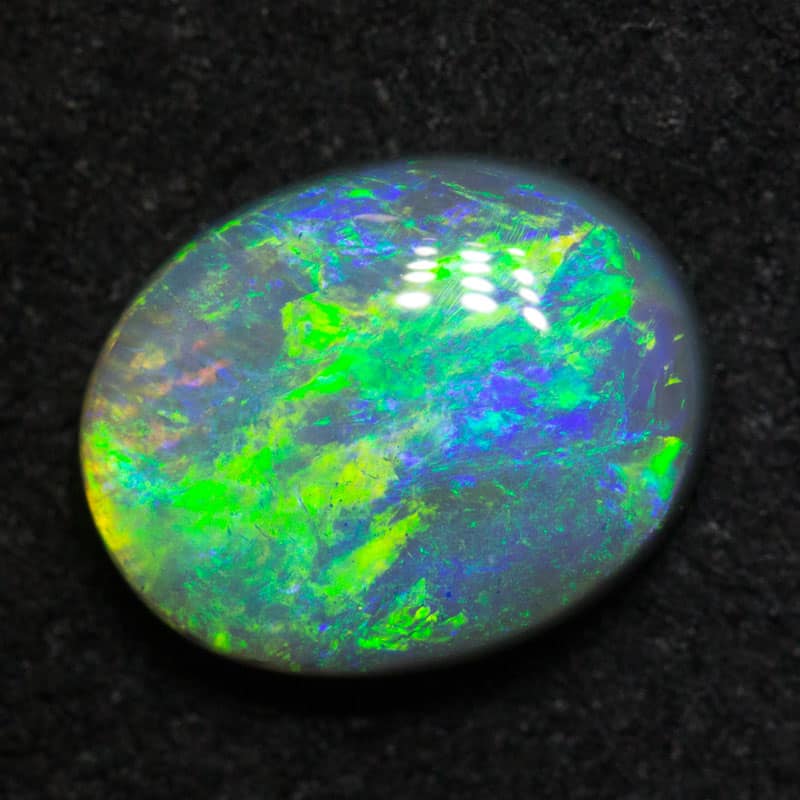 1.88 ct dark opal 9.7x7.7x3.4mm