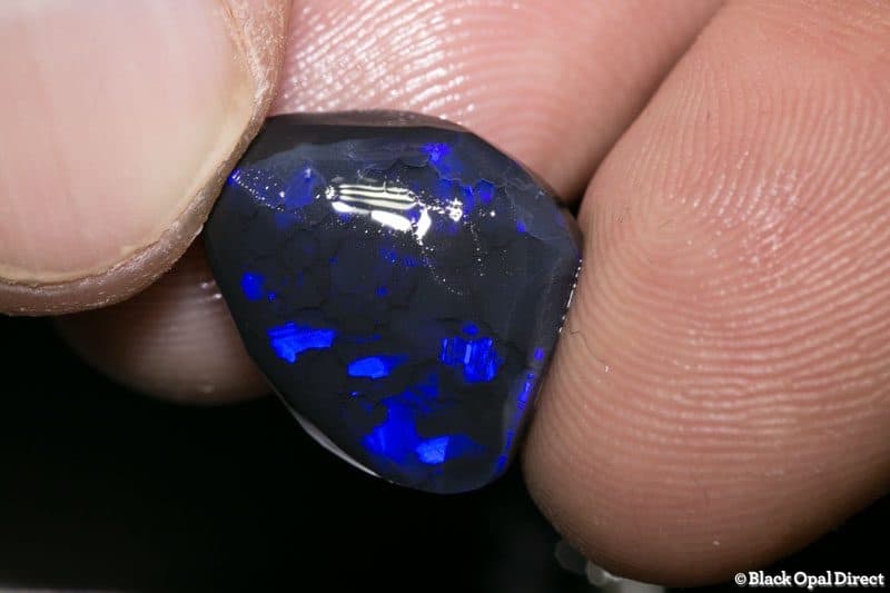 10.00 ct black opal rubbed piece 18mm across