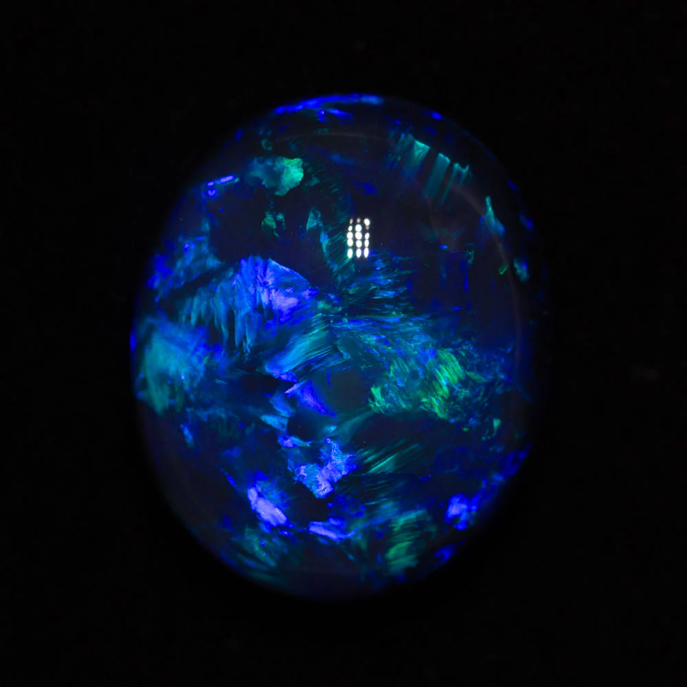 10.55 ct gem black opal 16.8x13x8.8mm