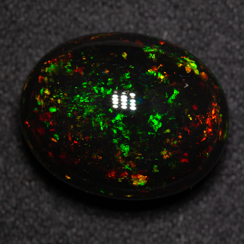 12.10 ct black opal 16.1x12.8x9.2mm