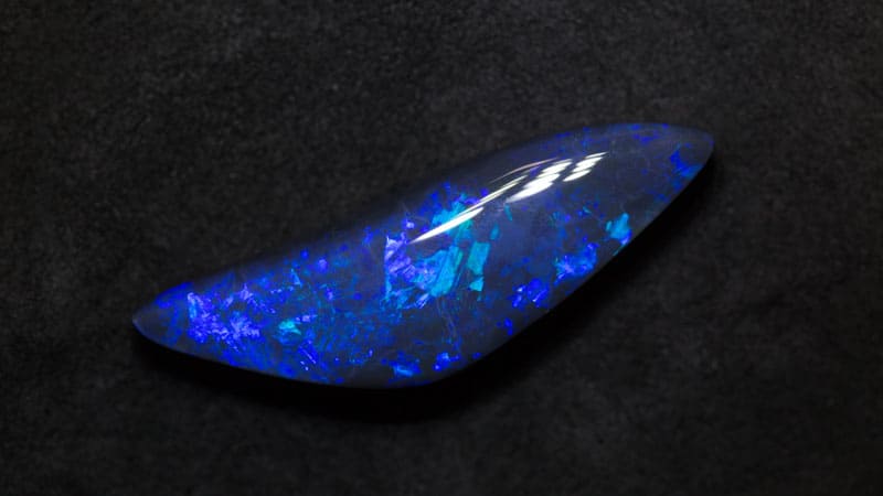 12.37 ct black opal 32x9.5x6.7mm