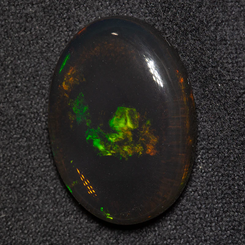 12.60 ct black opal 20.9x14.8x5.8mm