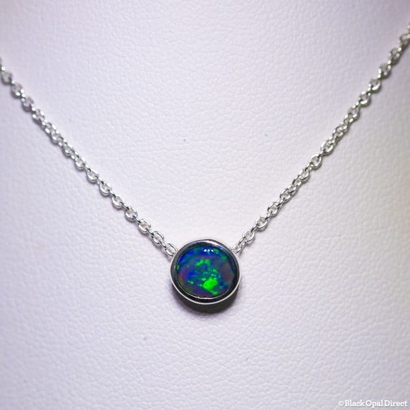 14kt white gold pendant with bezel set opal measuring 9.6x8.5x5mm