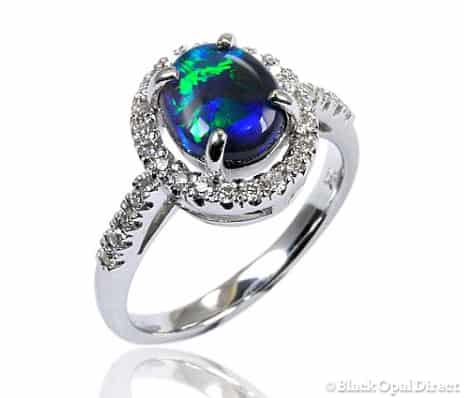 18K White Gold Ring with 32 diamonds, making charge + black opal
