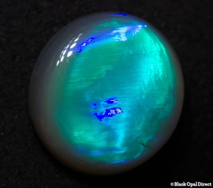 2.20 ct rolling flash semi black opal 10x9.5x3.5mm