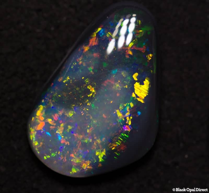 2.32 ct party colored black opal 13x9x3mm