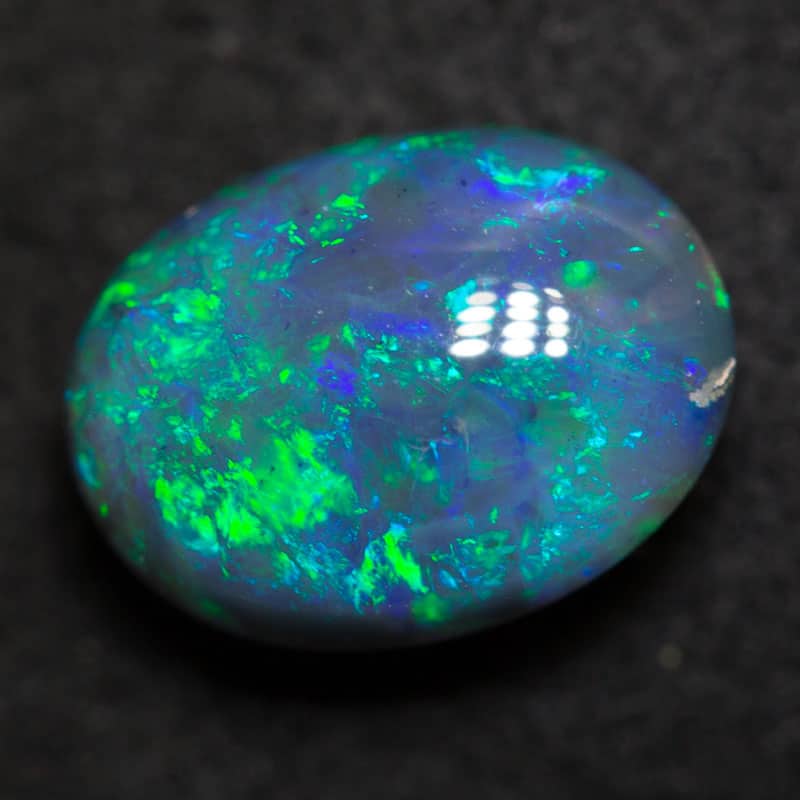 2.33 ct black opal 9.8x7.3x5.3mm