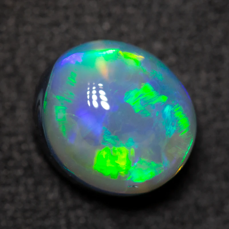 2.43 ct black opal 8.8x7.9x5.8mm