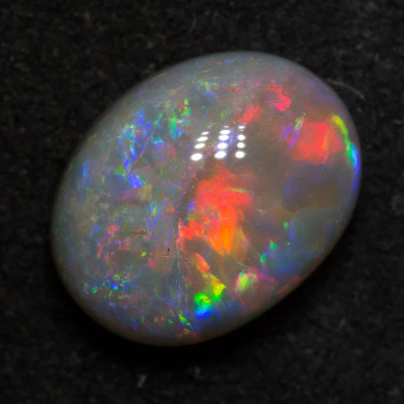 2.51 ct dark opal 9.9x7.7x5.1mm