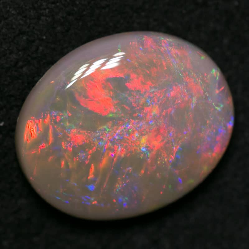 2.71 ct dark opal 12x10x3.5mm