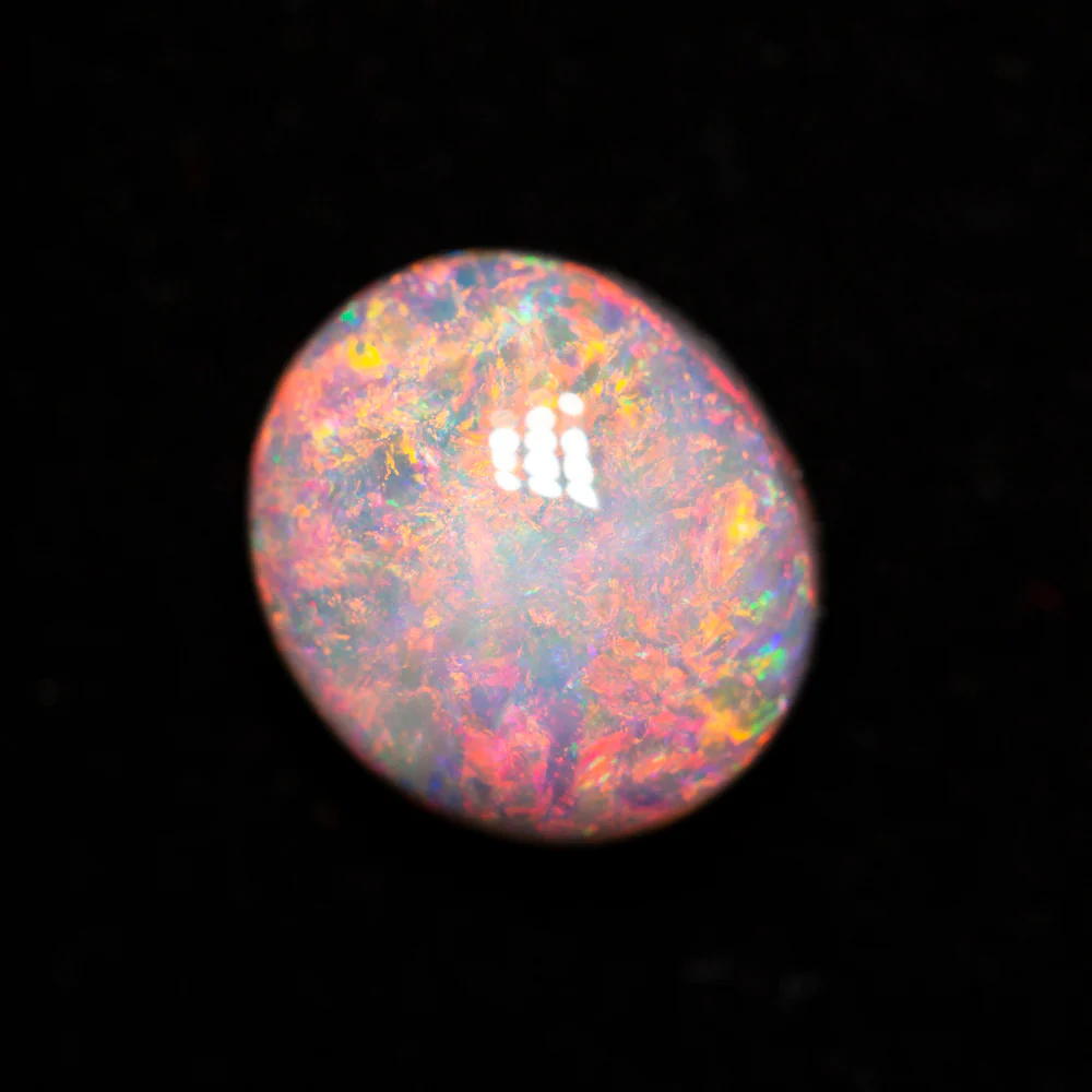 2.72 ct dark opal 9.7x8.6x5.4mm