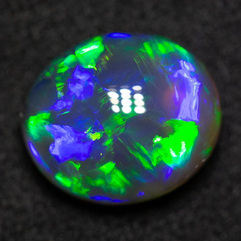 2.82 ct black opal 10.1x8.7x5.3mm
