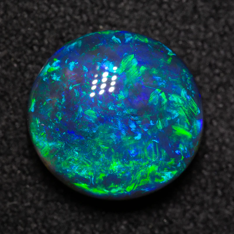 2.82 ct black opal 9.5x9.1x5.2mm