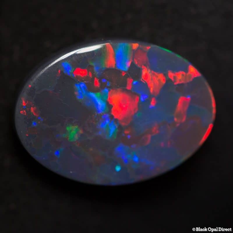 2.85 ct gem red blue on black opal 13x9x3mm