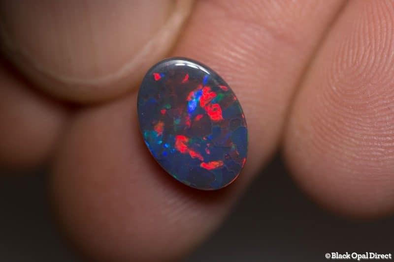 2.85 ct gem red blue on black opal 13x9x3mm - Image 2