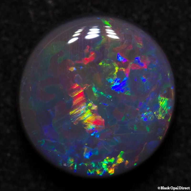 2.88 ct semi black opal 10mm round x4.5mm