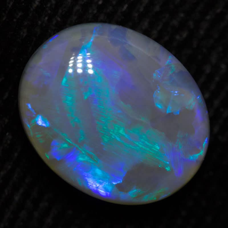 2.91 ct dark opal 11x9x5mm