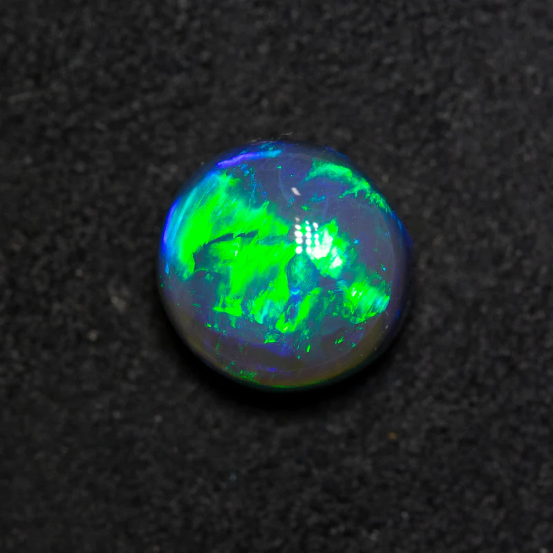 2.92 ct black opal gem 8.7x8.4x6.5mm
