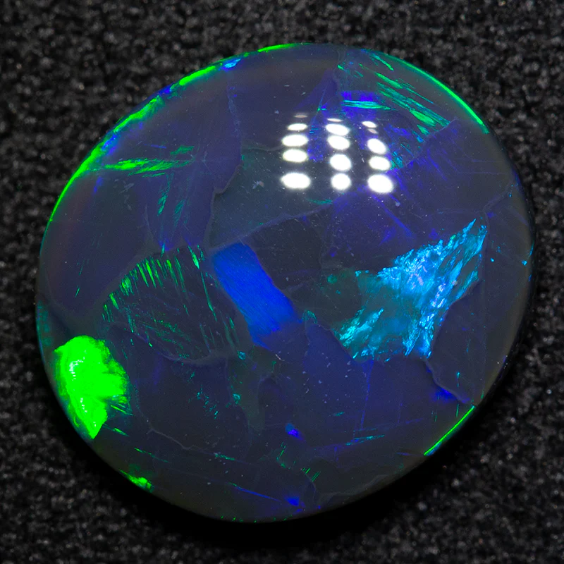 2.94 ct black opal 11.8x10.5x3.6mm
