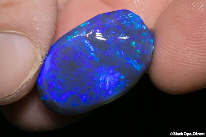 20.00 ct black opal rubbed piece 22mm across