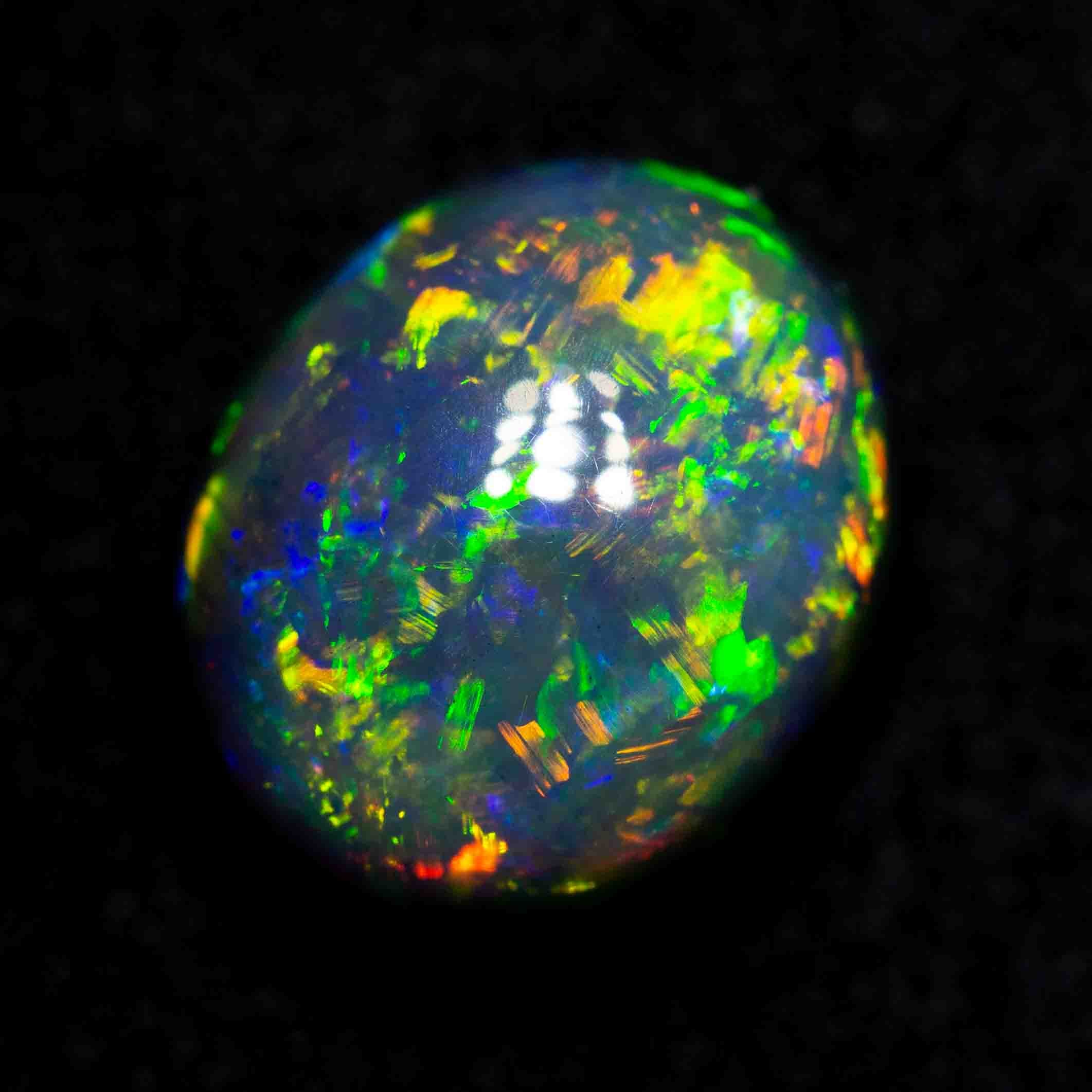 3.08 ct black opal 9.7x8.2x6.2mm